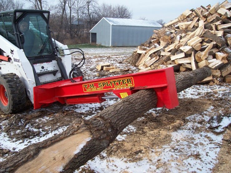 tm_pro_carrying_log.jpg TM Pro Log Splitter Skid Steer Attachment (24”, 30” or 36” Stroke) - Image 1